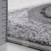 Designový tyrkysový koberec s abstraktním vzorem