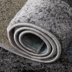 Designový tyrkysový koberec s abstraktním vzorem