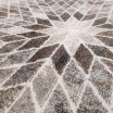 Moderní designový béžový koberec s přírodními motivy