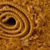 Kvalitní kusový koberec s vysokým vlasem v hořčicovo žluté barvě