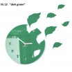 Designové zelené hodiny s efektem létajícího listí